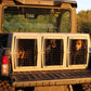  Easy Loader Three Hole Kennel loaded in a pickup truck bed.