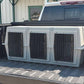 Easy Loader Three Hole Kennel loaded into a pickup truck bed.